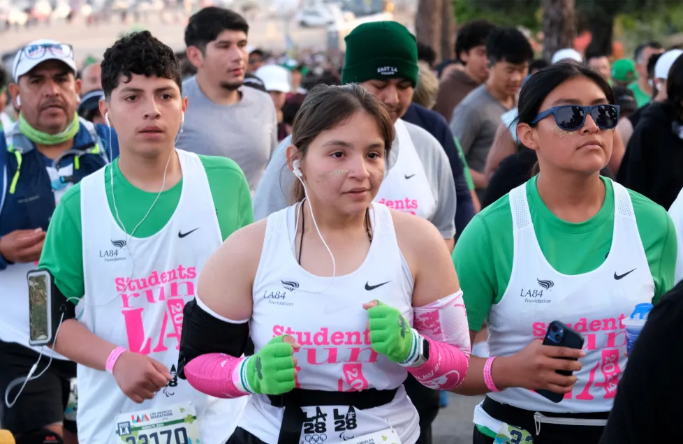 A group of young teenagers running marathon